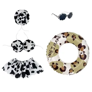 Cute cow print goose outfit set including hat bikini skirt sunglasses and swim ring.