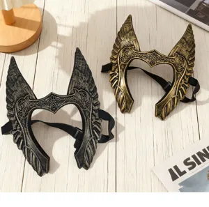 Detailed view of angel wing cosplay masks in dark silver and gold, perfect for stage.