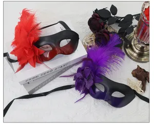 Details of feather masquerade mask with side flower for party costume ball dress-up.