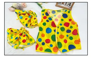 Detail view of the colorful polka dot clown vest and sleeve costume for holiday party.