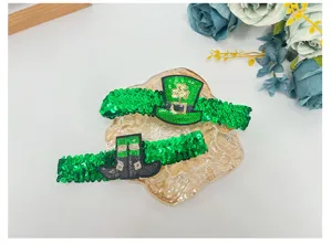 St. Patrick's Day green sequin headband detail shot, featuring shamrock hat and shoes.