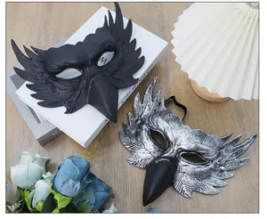 Detailed view of half face owl raven masks in black and silver with feather texture for cosplay.