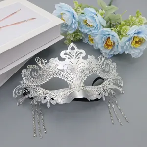 Silver masquerade mask with sparkling rhinestones and metal tassels for party props