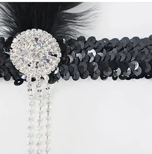 Detailed shot of 1920s black feather sequin rhinestone headband Gatsby hair accessory