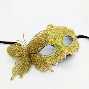 Gold glitter lace mask detail, side butterfly design with rhinestones and black ribbons for parties.