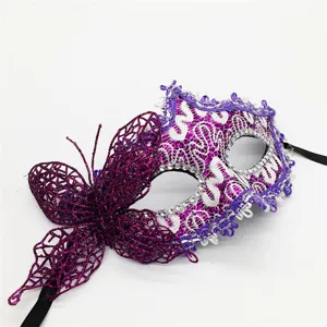 Detailed view of purple lace masquerade mask with glitter butterfly and sparkling rhinestones.