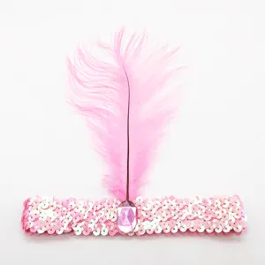 Diadema de plumas y lentejuelas rosas con gema central, ideal para fiesta de los años 20.