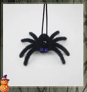 Halloween flocked spider hanging decoration with rhinestone eyes and string for spooky party.