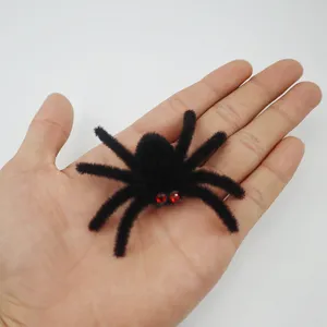 Halloween flocked spider decoration prop with red rhinestone eyes, perfect for scary pranks.