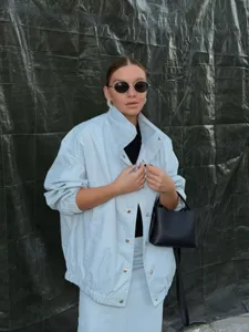 Detail view of the casual light blue lapel jacket and skirt set for women, stylish wear.