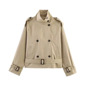 Detailed view of the short khaki trench coat collar, double-breasted buttons, and waist belt.
