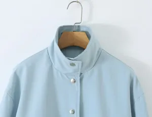 Light blue women trench coat collar detail shot, elegant daily fashion spring wear jacket.