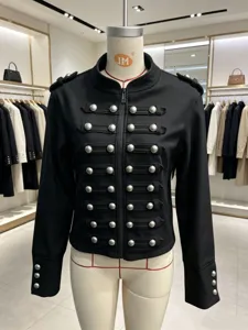 Black military style stand collar jacket with double breasted silver metal buttons and long sleeves.