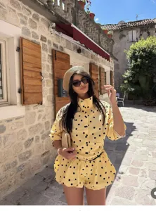 Yellow polka dot long sleeve high collar top and shorts set for women summer fashion style.
