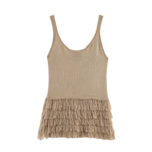 Close-up detail of women's fashionable khaki knitted camisole with stylish fringe hem.