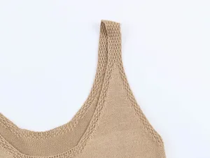 Detailed view of women's beige knit tank top, showcasing fine craftsmanship and elegant neckline.