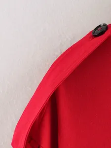 Red linen blend trench coat detail, showcasing quality fabric and button, fashion women outer.