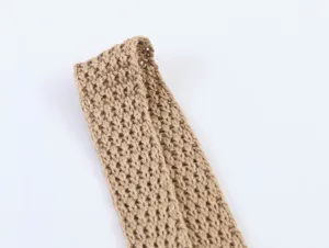Close-up detail shot of khaki knitted fabric strap showcasing the texture and pattern quality.