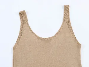 Close-up detail of the elegant beige knitted tank top showing fine strap and soft fabric texture.