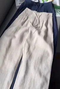 Detail view of cotton drawstring casual wide leg trousers, elegant and comfortable.