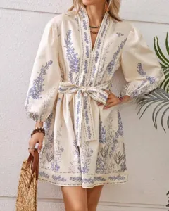 Bohemian floral print long sleeve V-neck dress detail view, elegant women dress with waist belt.