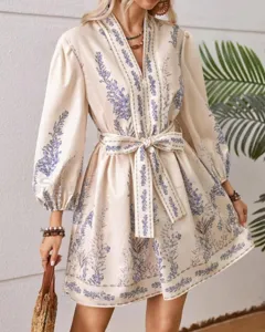 Women's V-neck long sleeve floral print bohemian mini dress with waist belt.