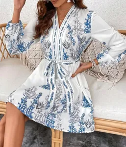 White V-neck long sleeve bohemian floral print dress lifestyle detail view feature
