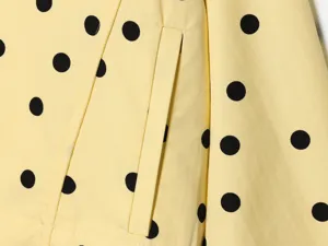 Yellow polka dot jacket pocket detail shot, showing clear fabric texture and neat stitching.