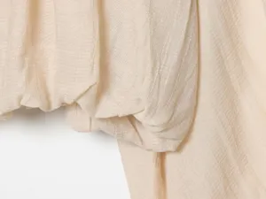 Close-up fabric detail of women casual ruffle hem stylish top and skirt clothing piece
