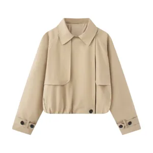 Close-up detail of stylish khaki short trench coat featuring lapel collar and cuffs.