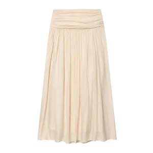Detailed view of a stylish beige pleated midi skirt featuring wide waistband and flowing drape.