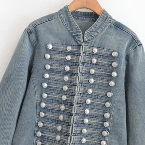 Detailed view of women denim jacket featuring military style button front and stand collar.