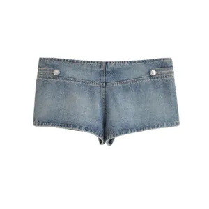 Detailed view of trendy women's denim hot pants with metal buttons and classic wash style.