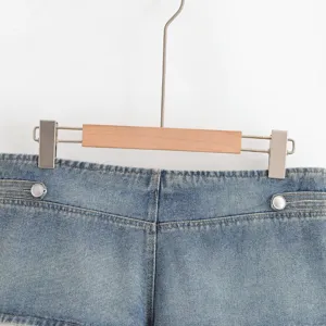 High waist blue denim shorts detail view, stylish street wear denim bottom for women.