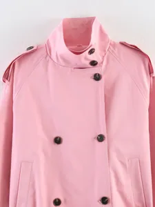 Pink trench coat detail, women's double-breasted lapel jacket with buttons and epaulets.