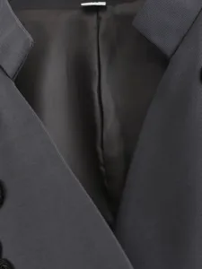 Detailed close-up view of the inner lining and collar design of a stylish sleeveless vest.