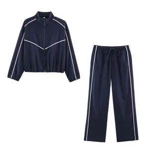 Detailed view of the women's casual navy tracksuit, featuring a zip-up jacket and matching pants.