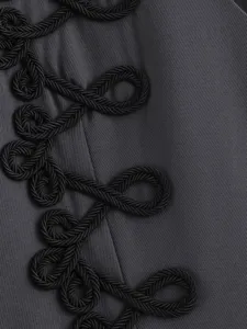 Close-up detail of dark grey women vest fabric featuring stylish black braided rope knots.