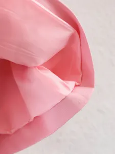 Pink trench coat detail close up fabric lining collar texture womens fashion outerwear