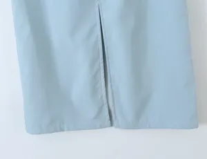 Light blue skirt hem detail showing clean stitching and front slit design for women fashion.