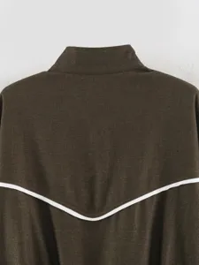 Detail view of the brown fashion stand-up collar jacket back with white contrast piping.