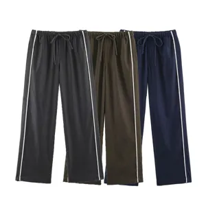 Detail view of casual lounge pants with elastic drawstring waist and stylish side stripes.