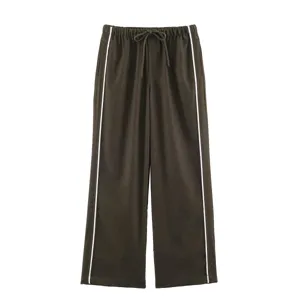 Casual wide-leg pants featuring elastic drawstring waist and chic white side stripes detail.