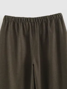 Detail shot of women's casual dark brown trousers showcasing elastic waistband and texture.