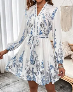 Chic boho blue floral print long sleeve V-neck short dress detail showcasing spring style.
