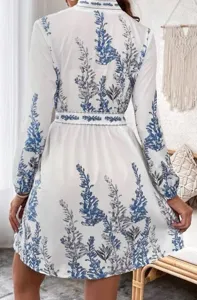 Back view of women's long sleeve bohemian floral print dress detail showcasing waist belt.