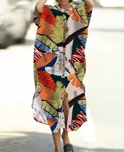 Closeup detail of tropical leaf print cardigan, lightweight fabric, front button design for summer.