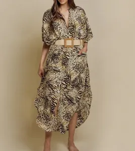 Detail shot of the animal print beach dress, featuring a V-neck, batwing sleeves, and a belt.