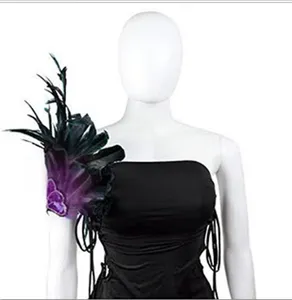 Black and purple feather shoulder piece detail shot, stage performance costume accessory.
