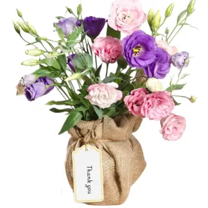 Stunning fresh lisianthus flower bouquet in rustic burlap sack with thank you tag for gift.